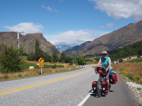 Climbing up to Arrowntown - queenstown in the background