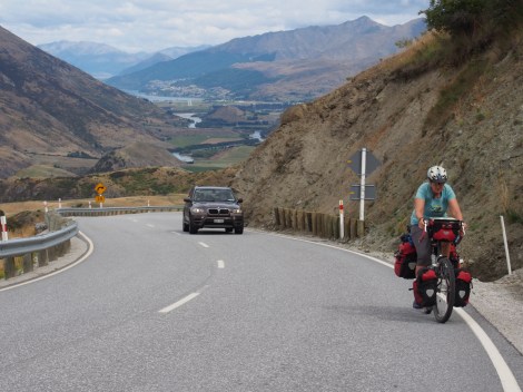 JP climbing to the summit - Queenstown in the background